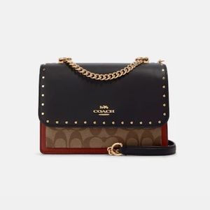 Klare Crossbody In Signature Canvas With Rivets - NEVER USED